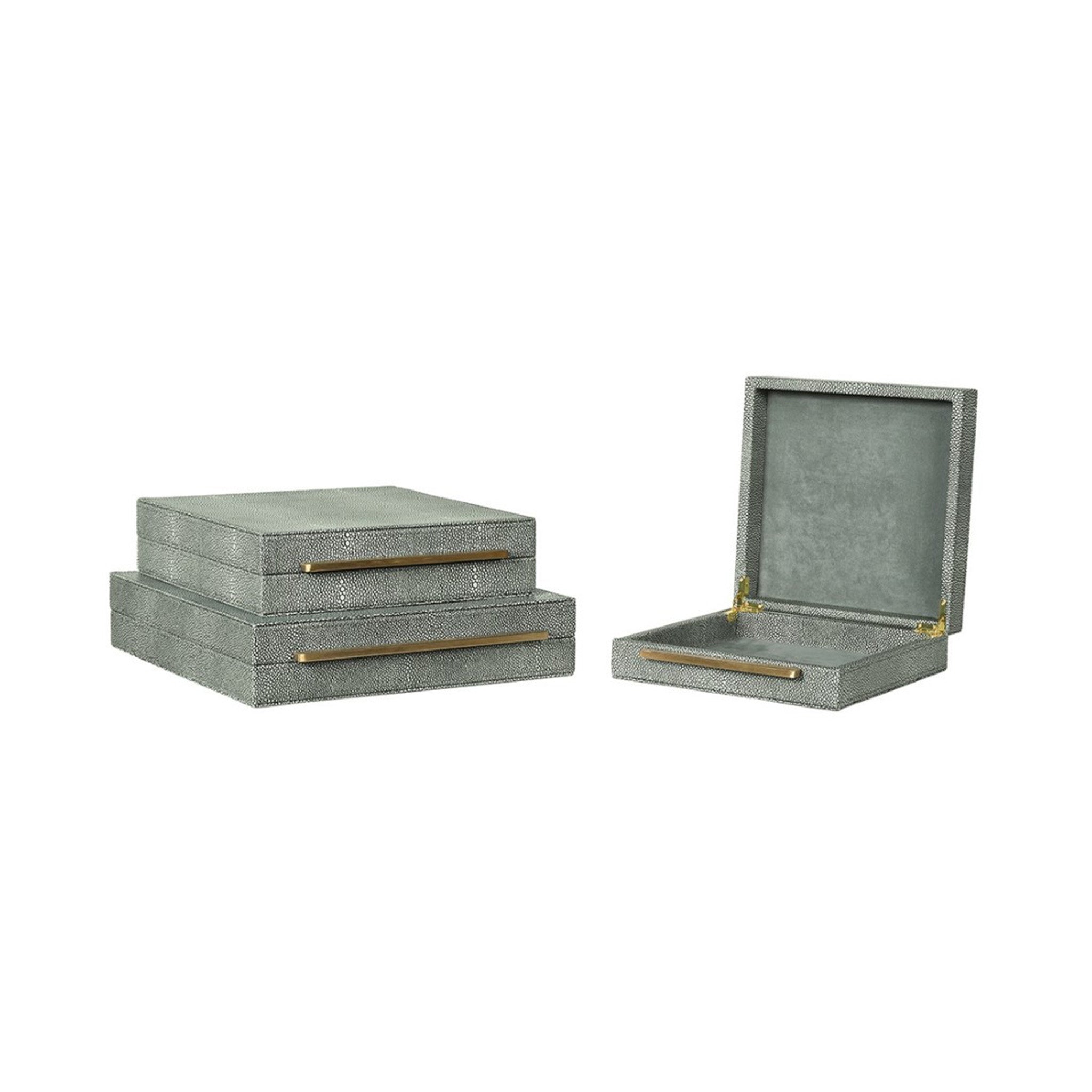 Set of 3 faux shagreen boxes in a green tone. All have a gold bar handle across the front opening
Dimensions: Large Box H:80 W:350 D:350 mm
Medium Box: H:80 W:300 D:300mm.
Small Box: H:80 W:250 D:250mm.